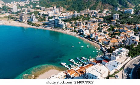 Aerial Top Down View Of Boat Dock And Yacht Port In Montenegro. White Private Motor Boats Are Moored To Pier On Adriatic Sea Coast. Yacht Club Boats Parking. Photo From Drone.