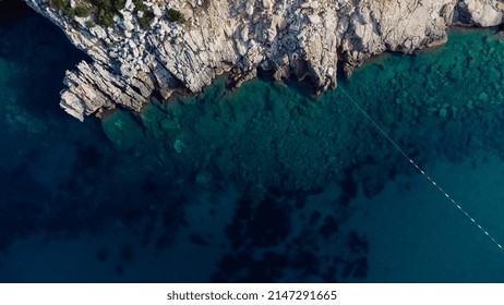 Aerial Top Down View Of Boat Dock And Yacht Port In Montenegro. White Private Motor Boats Are Moored To Pier On Adriatic Sea Coast. Yacht Club Boats Parking. Photo From Drone.