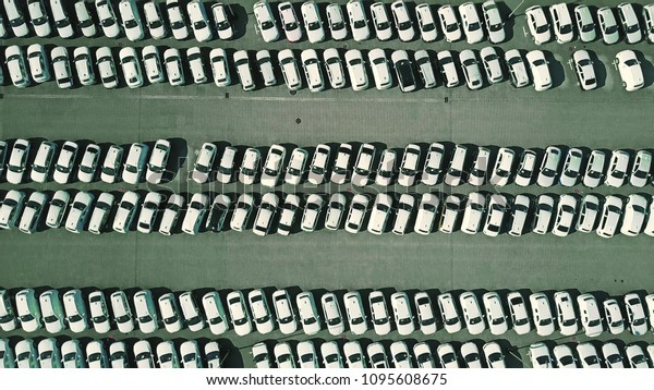 Aerial top\
down view of a car manufacturer\
warehouse