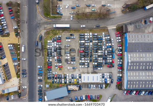 Aerial top down view of a car park located\
in the town of Leeds in West Yorkshire\
UK