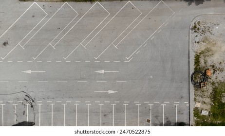 Aerial top down view of an empty and dirty parking lot