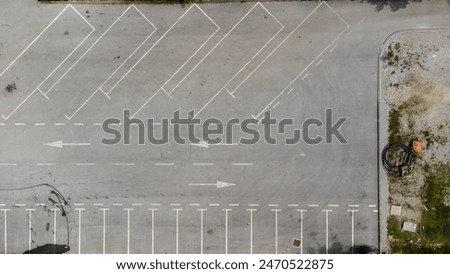 Aerial top down view of an empty and dirty parking lot