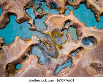 Aerial top down view of the geothermal area named Sol de Manana with sulfur springs and mud lakes in Bolivian Altiplano