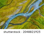 Aerial top down view of glacial river in Iceland, drone shot