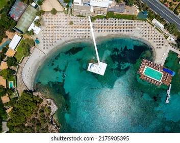 Aerial Top Down View Of The Grand Beach Lagonisi, Attica, Greece, With Turquoise Sea During Summer Time