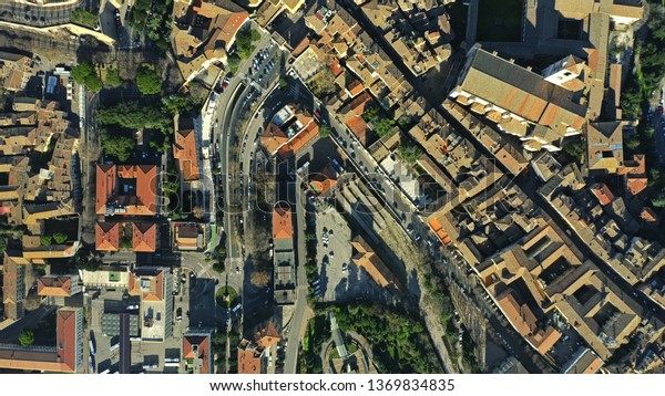 Aerial top down view of houses and streets in\
Perugia, Italy
