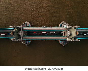 Aerial Top Down View To The Iconic Tower Bridge Over River Thames From Drone. Traffic Going Across The Bridge.