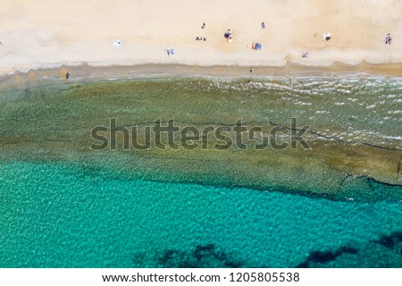 Aerial top down view of the Megali Ammos beach on Mykonos island, Cyclades, Greece