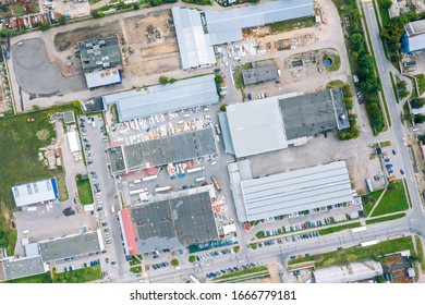 Aerial Top Down View On Roofs Of Industrial Building. Industrial Zone On City Suburb