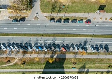 Aerial Top Down View Of Parked Cars On Empty Urban Road On Sunny Autumn Day