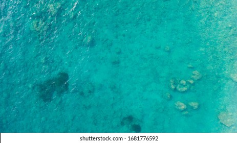 Aerial Top Down View Photo Of Azure Blue Ocean Waves Showing Beautiful Bright And Deep Blue Color From Sea Reef Shallow Water
