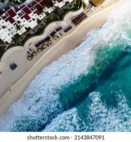 Aerial Top Down View Of A Rooftop Pool And Hotel In Cancun, Mexico. Amazing Ocean Beach From Above