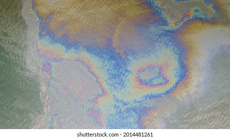 Aerial Top Down View To The Sea Surface With The Rainbow-colored Oil Spill Pattern In Tallinn City Area On The Baltic Sea, Estonia