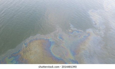 Aerial Top Down View To The Sea Surface With The Rainbow-colored Oil Spill Pattern In Tallinn City Area On The Baltic Sea, Estonia