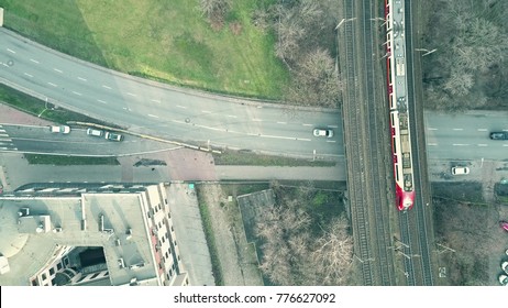 Aerial Top Down View Shot Involving Car Road Traffic And Moving Train