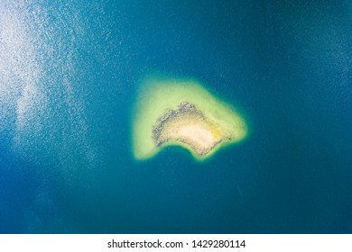 Aerial Top Down View Of Small Island. 