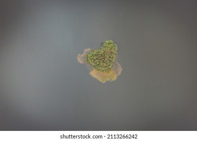 Aerial Top Down View Of Small Island On The Lake, Brown Toned Image