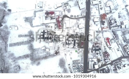 Aerial top down view of a typical Eastern European town in the snow