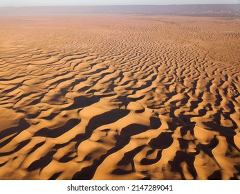 Aerial top high view landscape in Sahara desert at sunrise