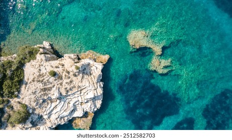 Aerial top panorama view of ocean shore huge bizarre granite rocks boulders on tropical beach with turquoise azure water. Amazing rock cliff seascape and coastline - Powered by Shutterstock