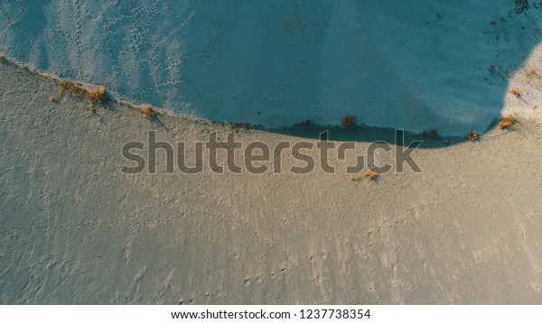 aerial
top vew of abdstrac desert dunes art
background