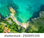 aerial top view above small island in front of Yanui beach in low tide. Sand dunes in the separate sea. Sandbars form in the Separated Sea when the water level goes down. green sea white sand beach
