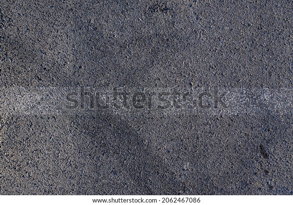 Aerial top view\
abstract texture and background of car tire drift skid mark on road\
race track, Black tire mark on street race track, Automobile and\
automotive concept.
