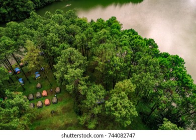 Aerial, top view adventures Camping tourism and tent under the view pine forest landscape near water outdoor at Pang-ung, pine forest park , Mae Hong Son, Thailand. Concept Travel  - Powered by Shutterstock