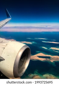 Aerial Top View From Airplane Coastline Egyptian Desert
Islands. Red Sea Sharm Al Sheikh Egypt. Amazing Shoot Bird Eye Plane Window Mountains. Travel Concept. Turbine Aircraft Engine Flying Over Ocean