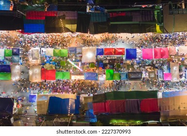 Aerial top view of amusement park in night temple fair, and night local markets. People walking street, Colorful tents in Bangkok city, Thailand. Retail shops - Powered by Shutterstock