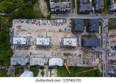 Aerial top view of big construction site. Building new apartment blocks in residential area, aerial drone top down view.
