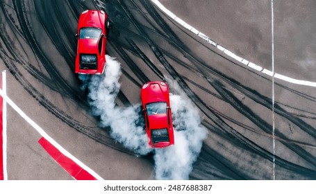 Aerial top view car drifting, Race drift car with lots of smoke from burning tires on speed track, Two car drifting battle on asphalt race track, Two drift cars battle with smoke from burned tire. - Powered by Shutterstock