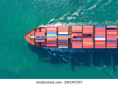 Aerial top view of cargo ship carrying container for import export goods  to customer,concept logistic and supply chain.