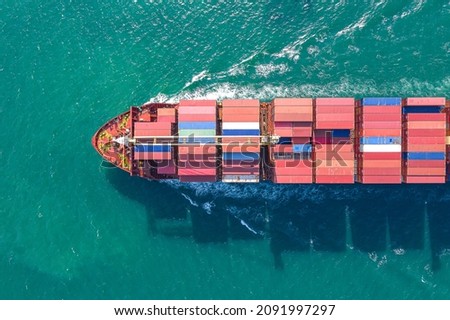 Aerial top view of cargo ship carrying container for import export goods  to customer,concept logistic and supply chain.