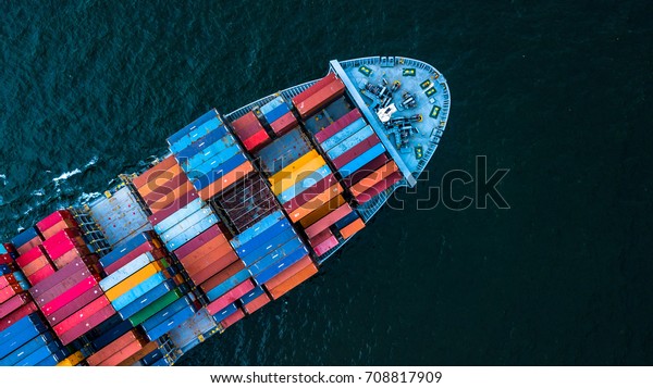 Aerial top view container cargo ship in import\
export business commercial trade logistic and transportation of\
international by container cargo ship in the open sea, Container\
cargo freight shipping.