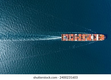 Aerial top view container ship in export and import business and logistics. Shipping cargo to harbor by crane. - Powered by Shutterstock