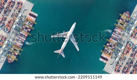 Aerial top view of Container ship loading and unloading, Cargo container in deep seaport for the international order. Transportation and travel concept.