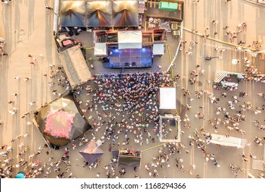 Aerial Top View Of Crowd Of People Standing Near The Stage On A Concert On Summer Day