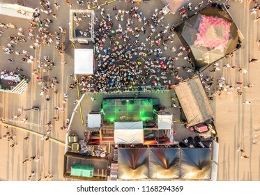 Aerial Top View Of Crowd Of People Standing Near The Stage On A Concert On Summer Day