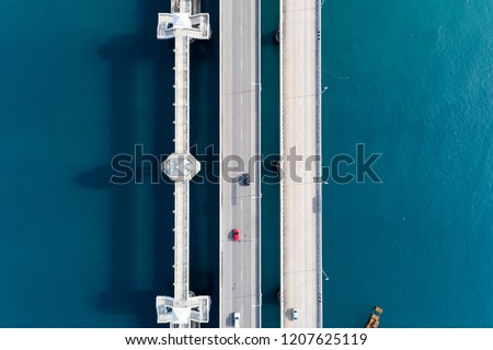 Aerial top view drone shot of bridge with cars on bridge road image transportation background concept.