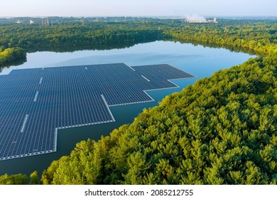 Aerial top view of environmentally friendly energy with floating solar panels platform system on the lake