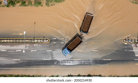 Aerial Top View Of Flooded The Village And Country Road With Car, View From Above Shot By Drone