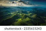 Aerial top view forest tree, Rainforest ecosystem and healthy environment concept background, Texture of green tree forest view from above, Beautiful sunrise over the mountains of western Thailand.