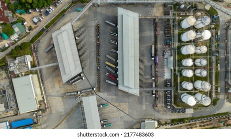 Aerial Top View Of Fuel Tanker Trucks At Truck Park In Oil Refinery Terminal Plant. Oil Tanker Trucks Stand By For Loading Diesel Gasoline For Supply To Dealer Jobber Customers,Petrochemical Logistic 