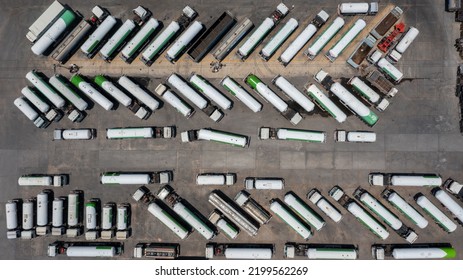 Aerial Top View Gas Truck Fuel Tanker Truck, Aerial View Of Parking Lot With Gas And Fuel Trucks.