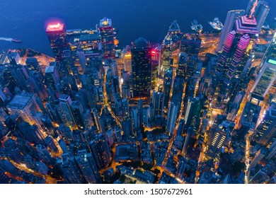 Aerial Top View Of Hong Kong Downtown, Republic Of China. Financial District And Business Centers In Technology Smart City In Asia. Top View Of Skyscraper And High-rise Modern Buildings At Night.