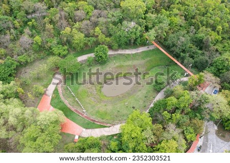 Aerial top view of Kradong Volcano with forest trees in Buriram, Thailand. Tourist attraction landmark. Nature landscape background