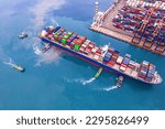 Aerial top view of Logistics and transportation of Container Cargo ship and Cargo plane with working crane bridge in shipyard.