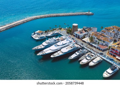 Aerial top view of luxury yachts in Puerto Banus marina, Marbella, Spain. 04.05.2021