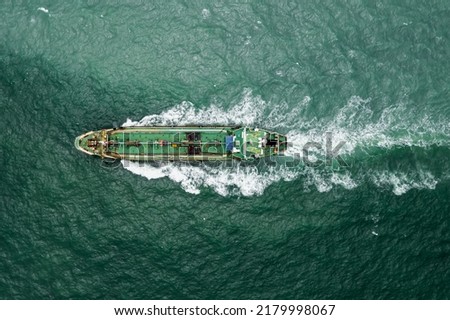 aerial top view oil thanker ship and LPG gass full speed in green sea transportation from crude oil drilling rig for crude oil refinery, photograph drone of point view,